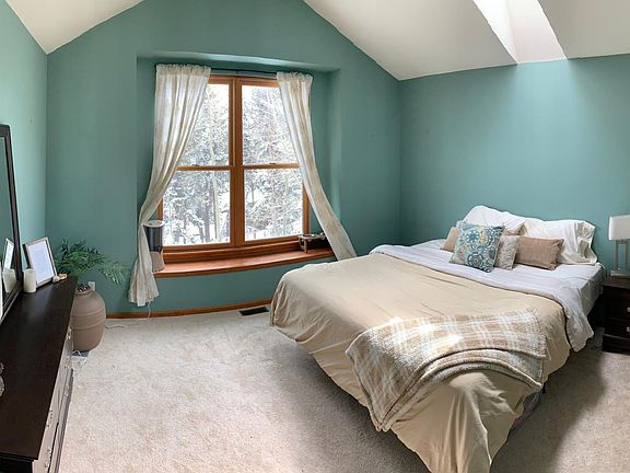 Master bedroom - king bed (not included). Views all the way to Denver!