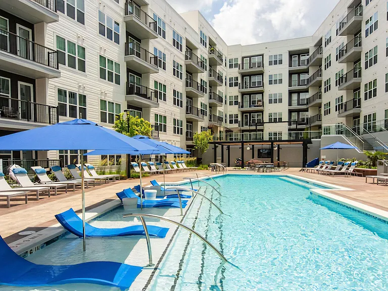 Resident Pool at The Elden Galleria with In-Water Loungers and Umbrellas