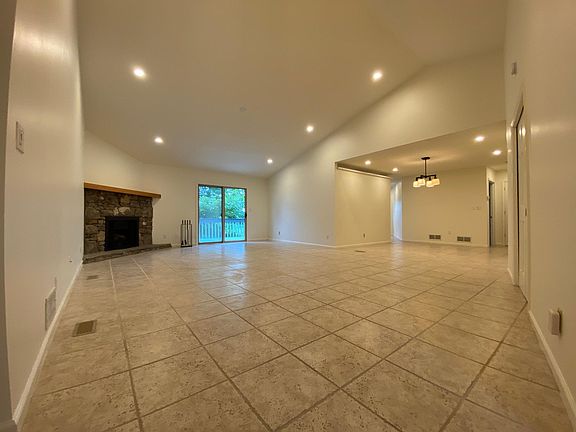 Living Room with Gas Burning Fireplace and Dinning Room