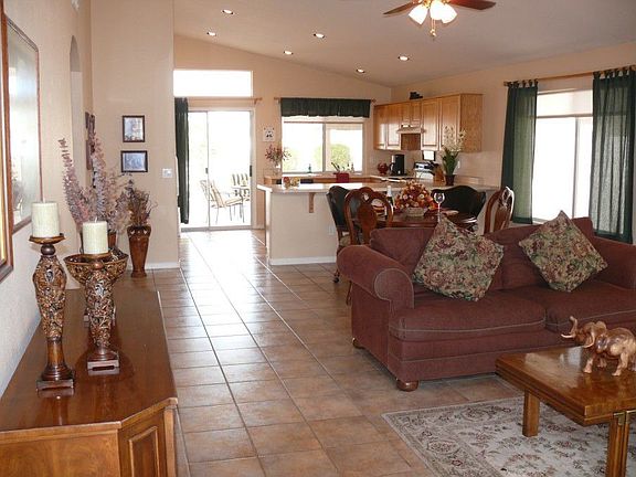 Great room with vaulted ceilings and beautiful tile throughout.  