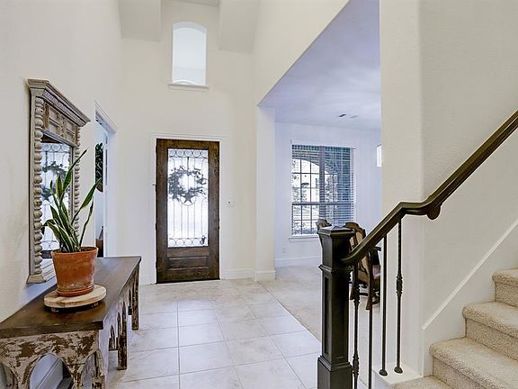 There is a 2 story tiled entrance as you enter the home with great architectural detail and extra window over the door to let in lots of natural light into the the foyer.