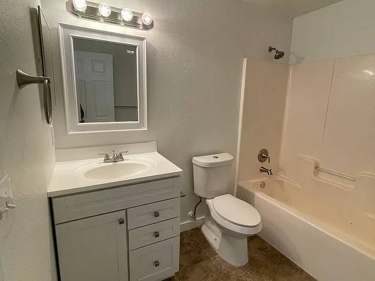Master bedroom has a new installed vanity and mirror. All new shower fixtures as well.