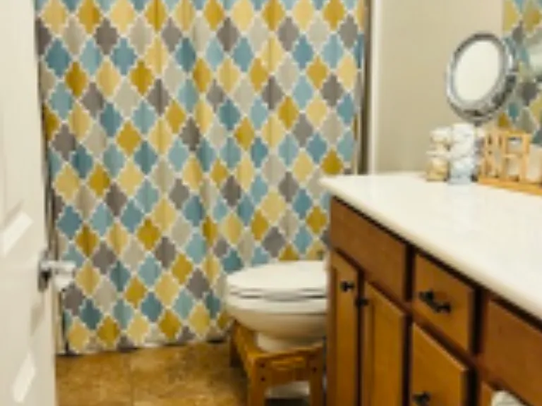 Shared bathroom with your own towel rack and under the sink storage.