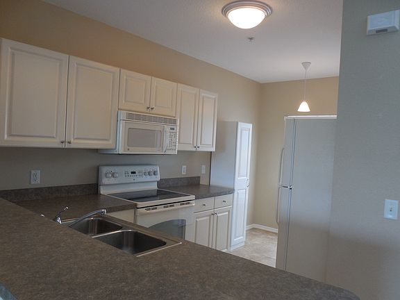 Kitchen with lots of cabinet spaces & pantry closet