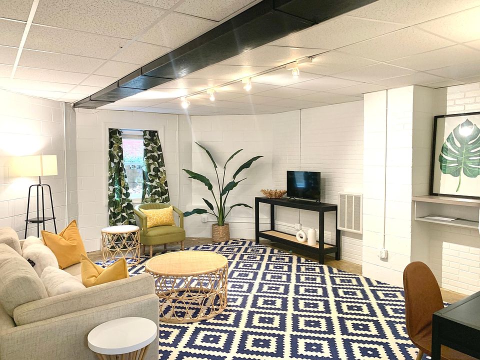 Living room is in the center of the apartment with bedrooms on both sides