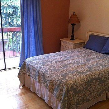 Second bedroom with full size bed, bamboo floors, private ba