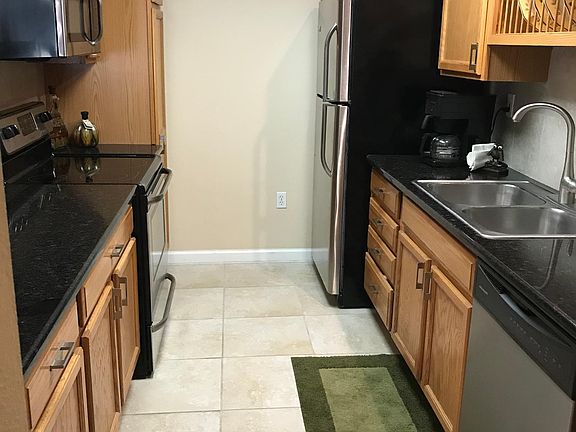 Upgraded Kitchen with granite countertops and stainless steel appliances