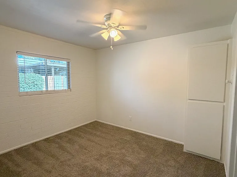 Bedroom with window and storage