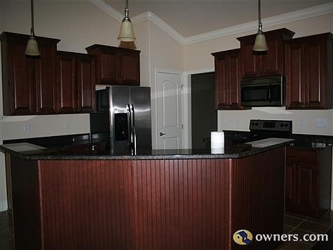 Open floor plan with large kitchen island with granite