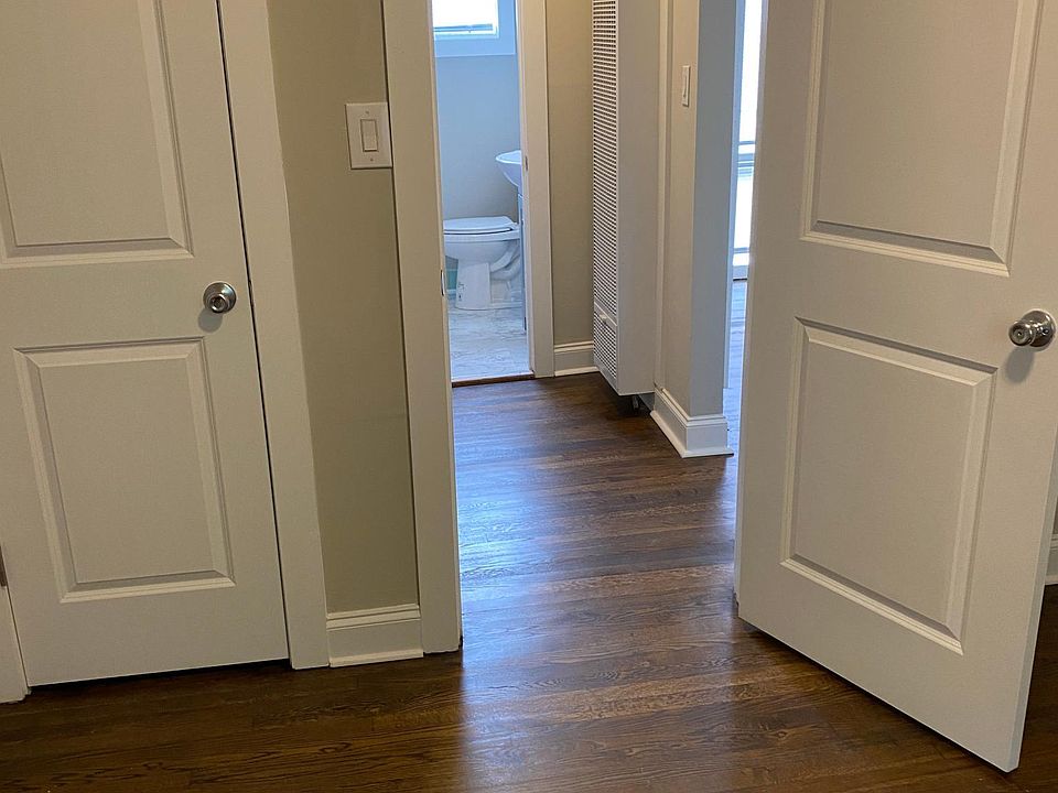 Bedroom looking into hallway towards living room and bathroom
