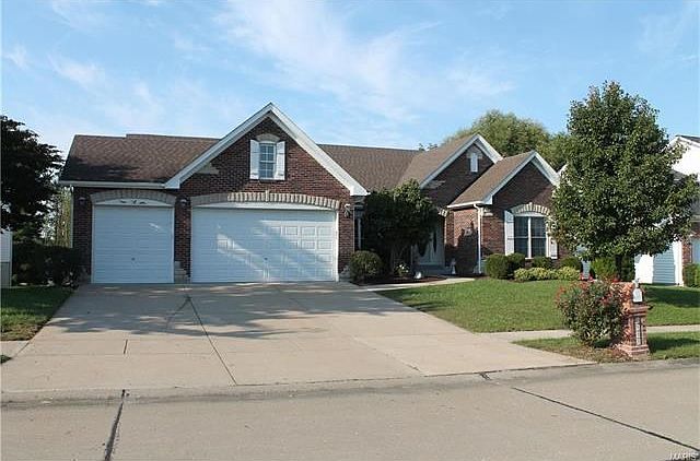 Brick and Stone, 3 car garage!