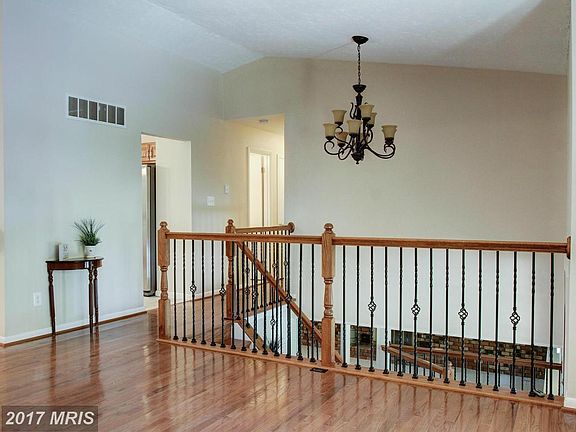 Vaulted Ceiling, New Flooring and Iron Railings