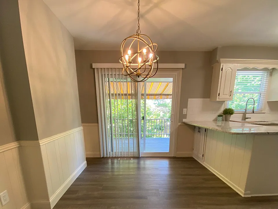 eat-in kitchen walks out to a covered deck