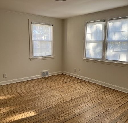Sunny Living Room - Abundant Windows & Refinished Hardwood Floors