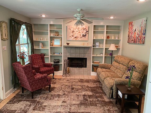 Living room with wood burning fireplace