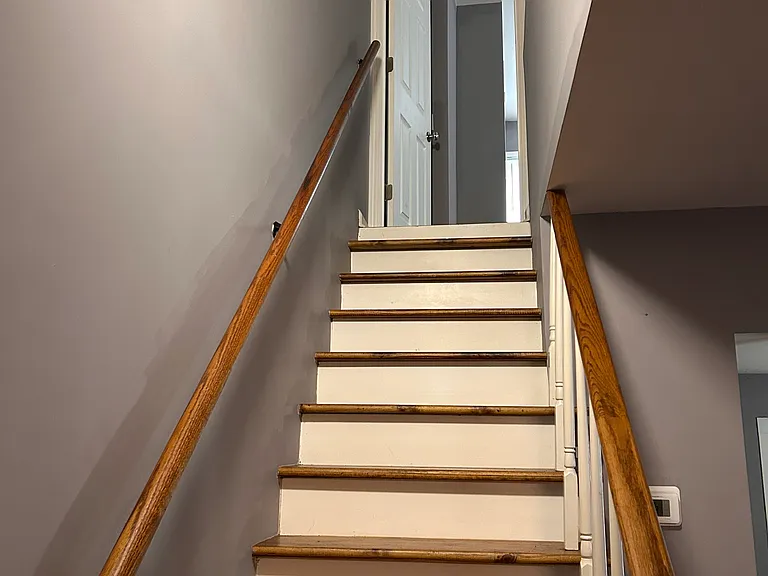 Stairs going up the Master Bedroom with Attached Bathroom and Attic space