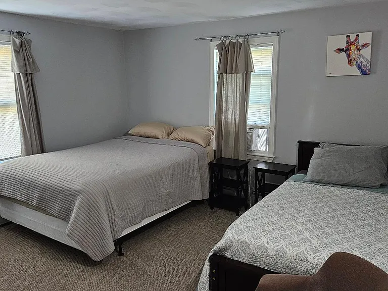 Bedroom #1 with a Queen- and a full-size bed