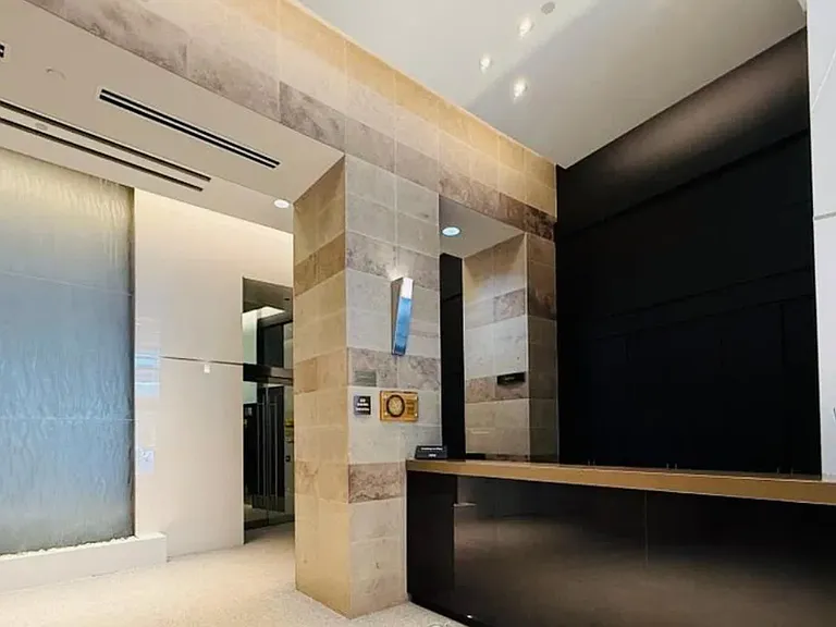 24 Hour Concierge Security & Service. Elegant Wall Fountain compliments entrance.