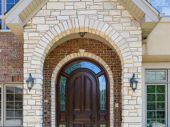 Mahogony Wood Door with Ornate Glass Surround