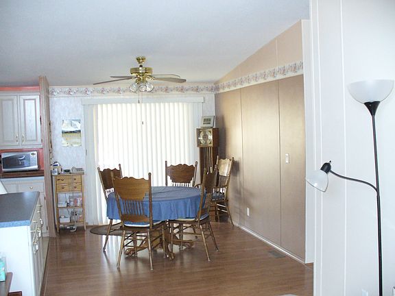 Partial kitchen and dining area
