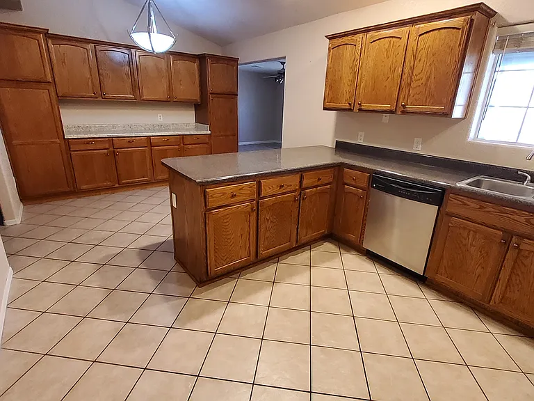 Kitchen with additional storage and counter bar
