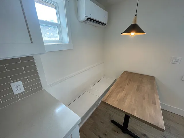 Custom built in banquet seating with storage in the bench. Custom made butcher block table that is with the home.