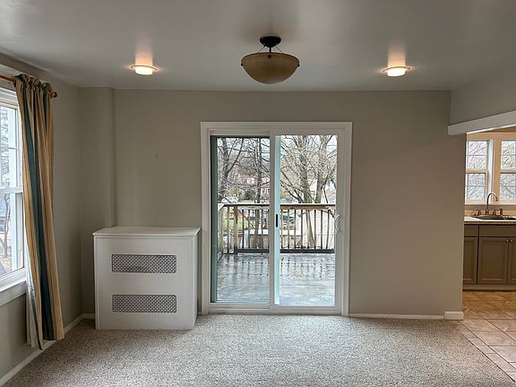 Dining Room with new sliding glass doors leading the balcony.