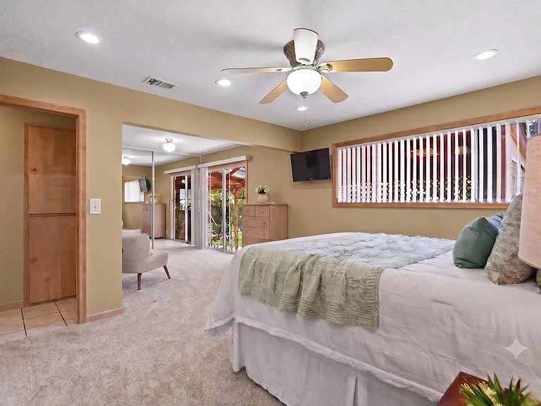 Master bedroom with sliding door opens directly to the covered patio