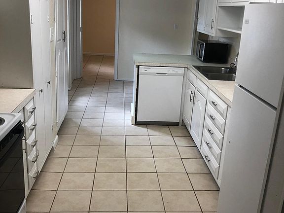 Kitchen: dishwasher, garbage disposal, range and refrigerator