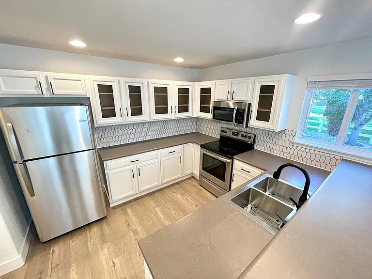 New stainless steel appliances in refreshed kitchen