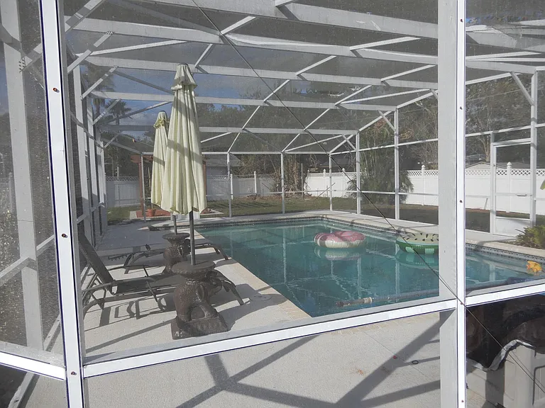 SUMMER WITHOUT MOSQUITES AND OTHER INSECTS. LARGE SCREENED POOL AREA.