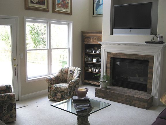 two story fam room w/fireplace boasts lots of light!