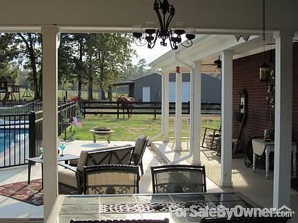 PERFECT FOR ENTERTAINING
						:
						Relax on the patio with views of the pool and barn.