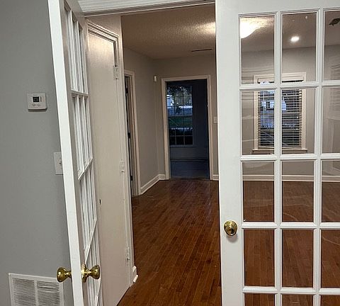 French doors separate living and dining room