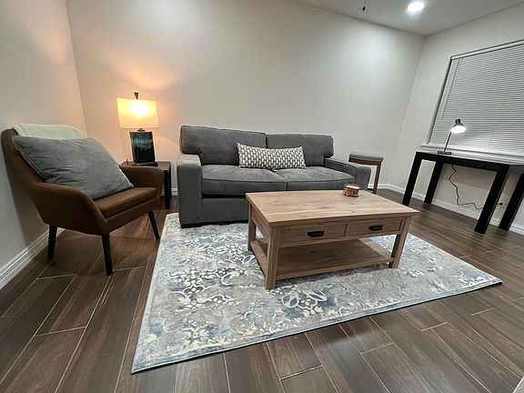 Living area with desk. New floors. New furniture. Ele
