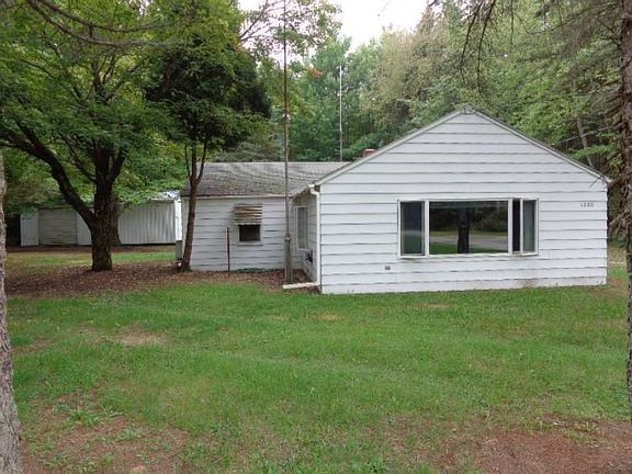 Additional view of the house and pole barn.