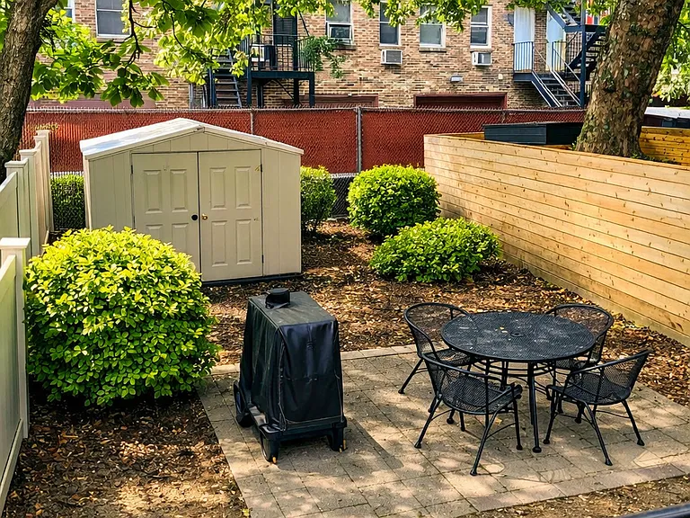 Beautiful backyard with enough room to put out your own propane or electric BBQ.