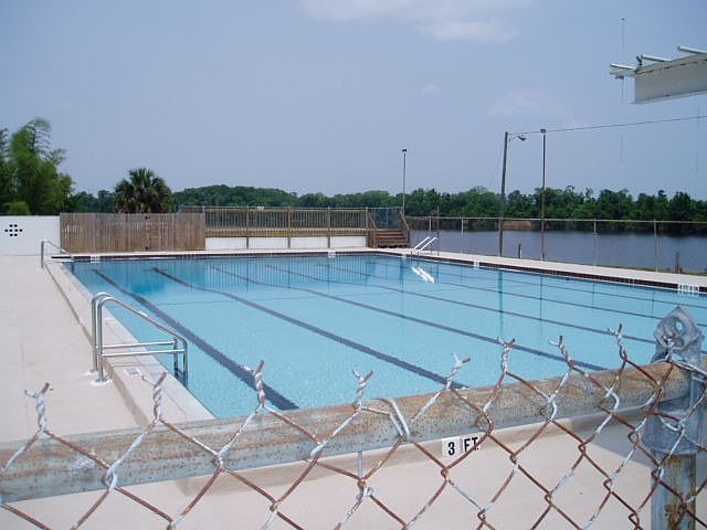 Community offers pool, tennis and basketball courts, playground and small lake