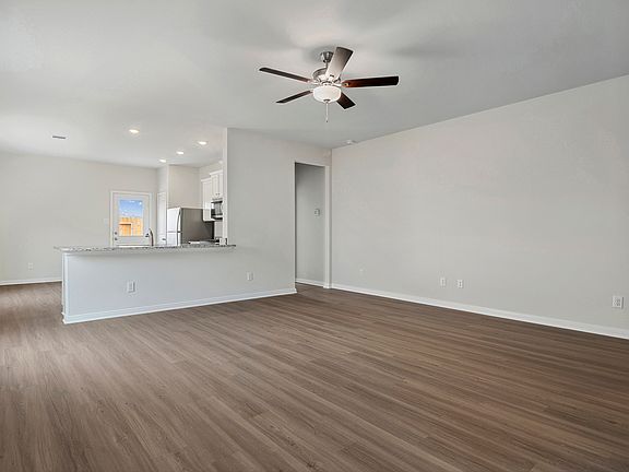Spacious family room with vinyl flooring