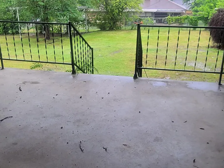 Back Covered Porch. If you look close you can also see the one car carport available to use.