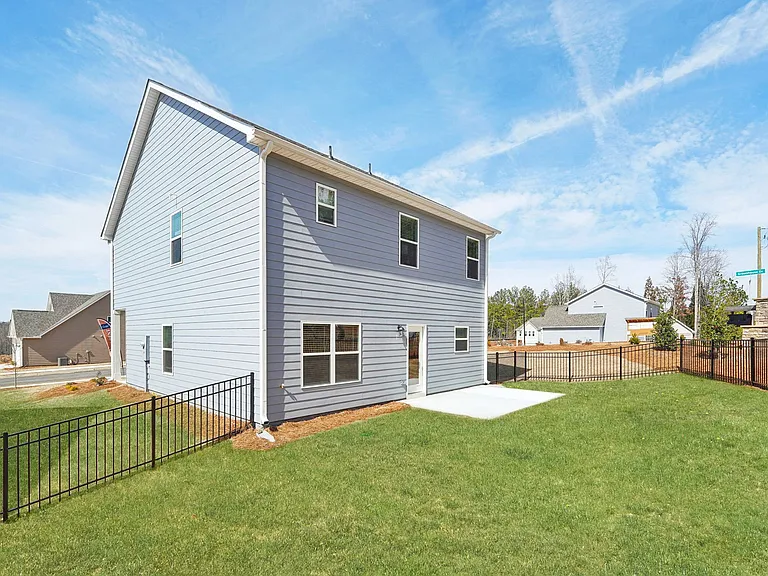 Back patio with fenced in yard.