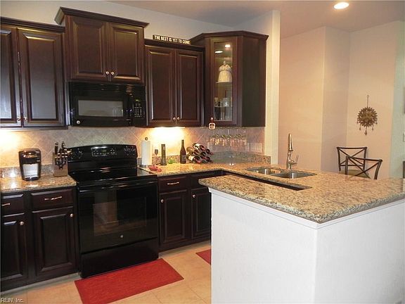 KITCHEN WITH GRANITE COUNTER TOP AND UNDER CABINET LIGHTING