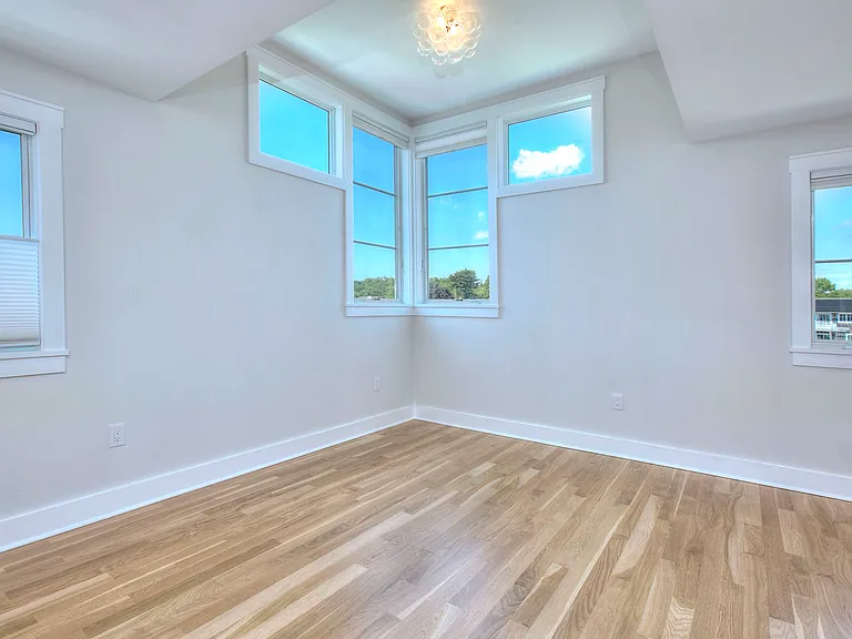 Sun filled bedroom suite 4 with walk-in closet and bath.
