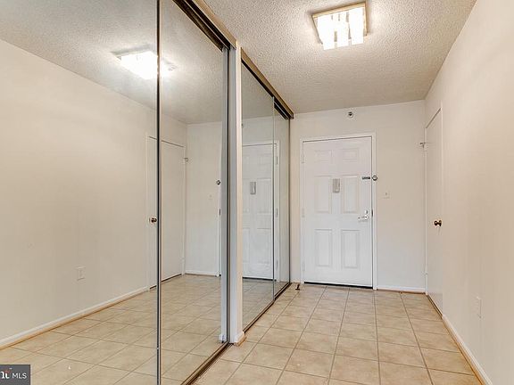 Large entry foyer with three large closets