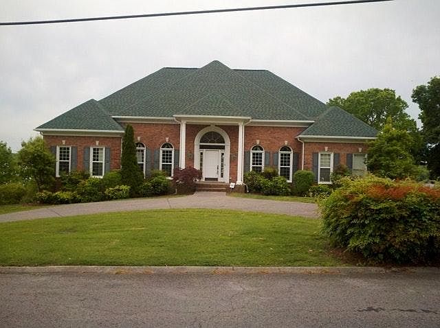 The front of the home with a circular driveway.