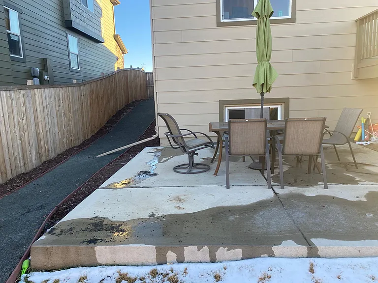 Concrete patio and side yard entrance
