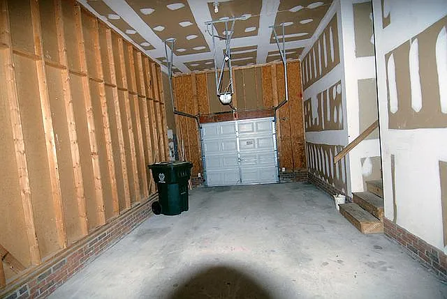 Spacious garage long enough for two compact cars