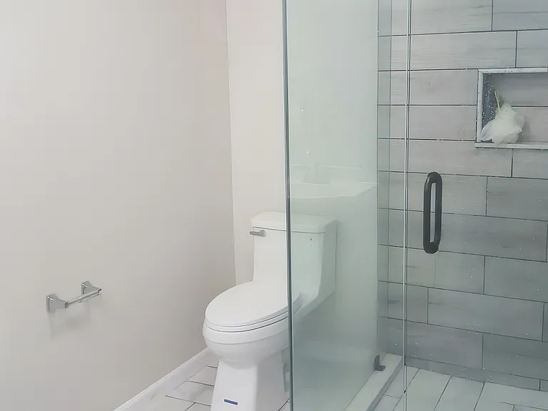 Newly renovated bathroom with walk-in shower.