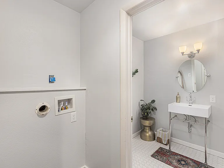 Main floor washer dryer hook up or pantry area and 2nd bathroom upstairs with rain shower not shown