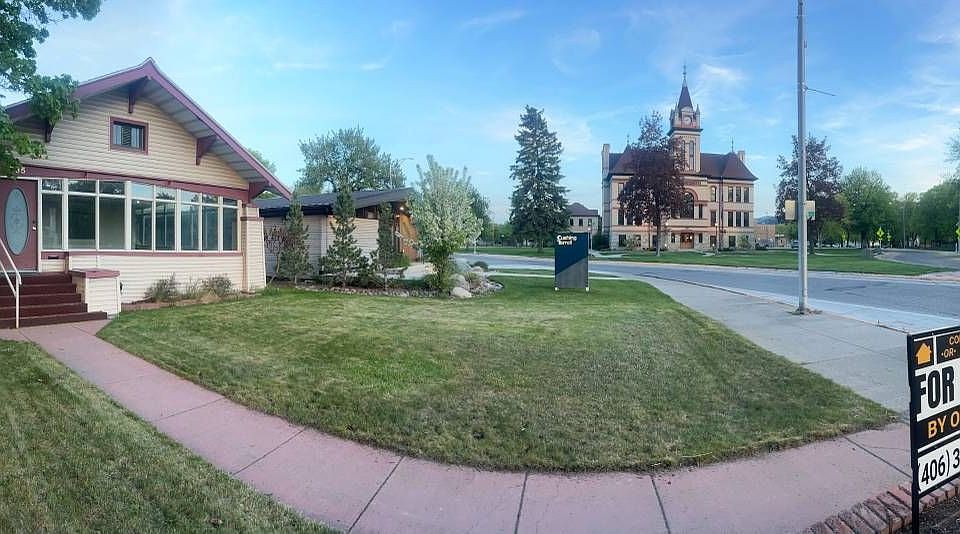 View of front of House, Courthouse in the background